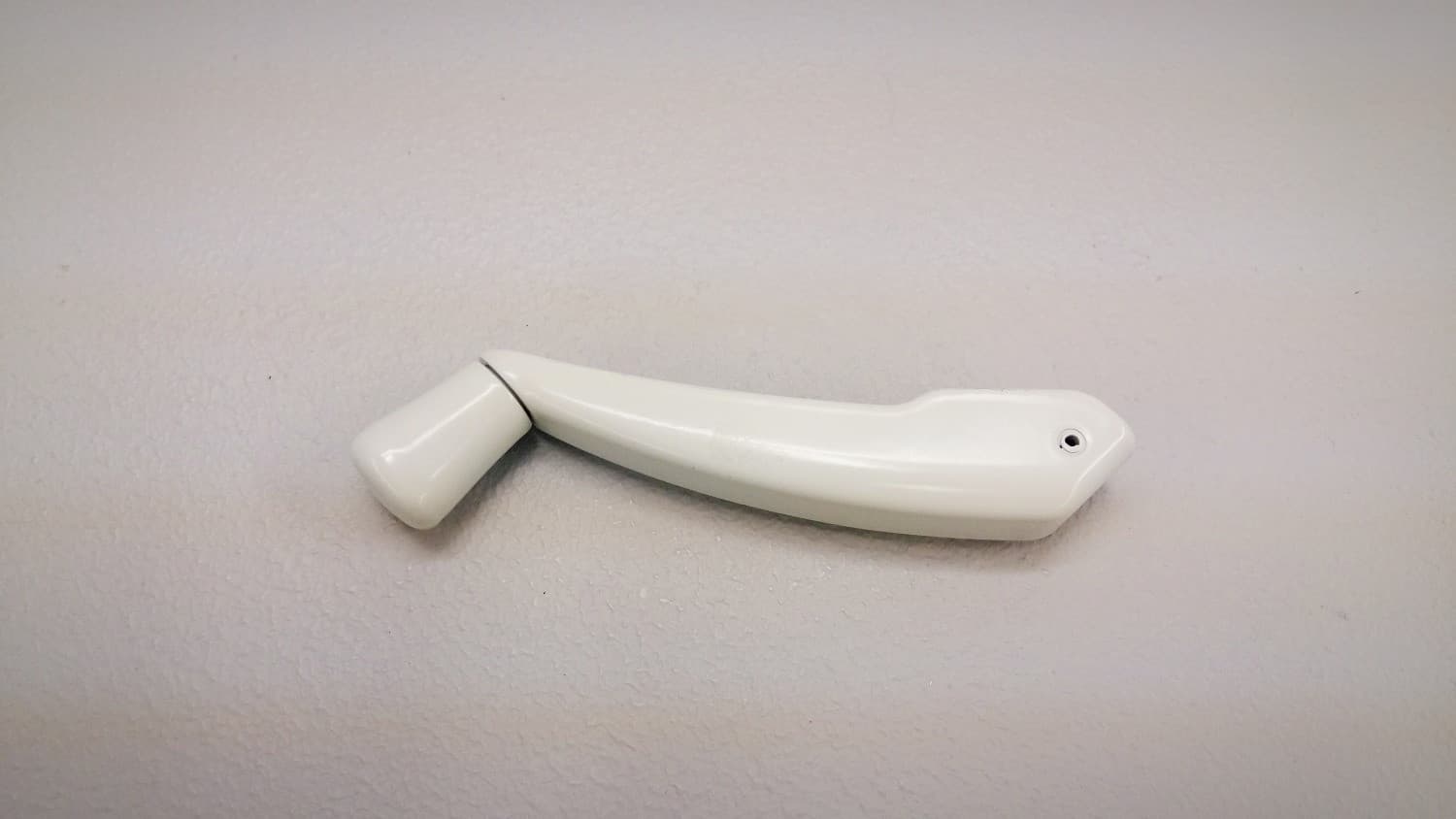 Poignee pliante pour opérateur de fenêtre à battant blanc - Image 1